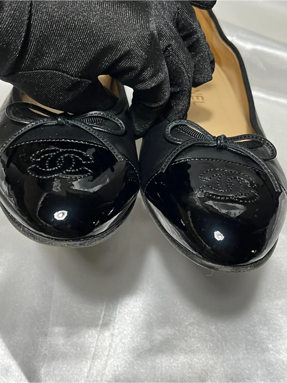 CHANEL Black Leather Ballet Flats with Patent Cap Toe & CC Motif